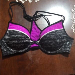 Pink bra, snaps in the front.